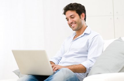 Guy on Couch with Laptop